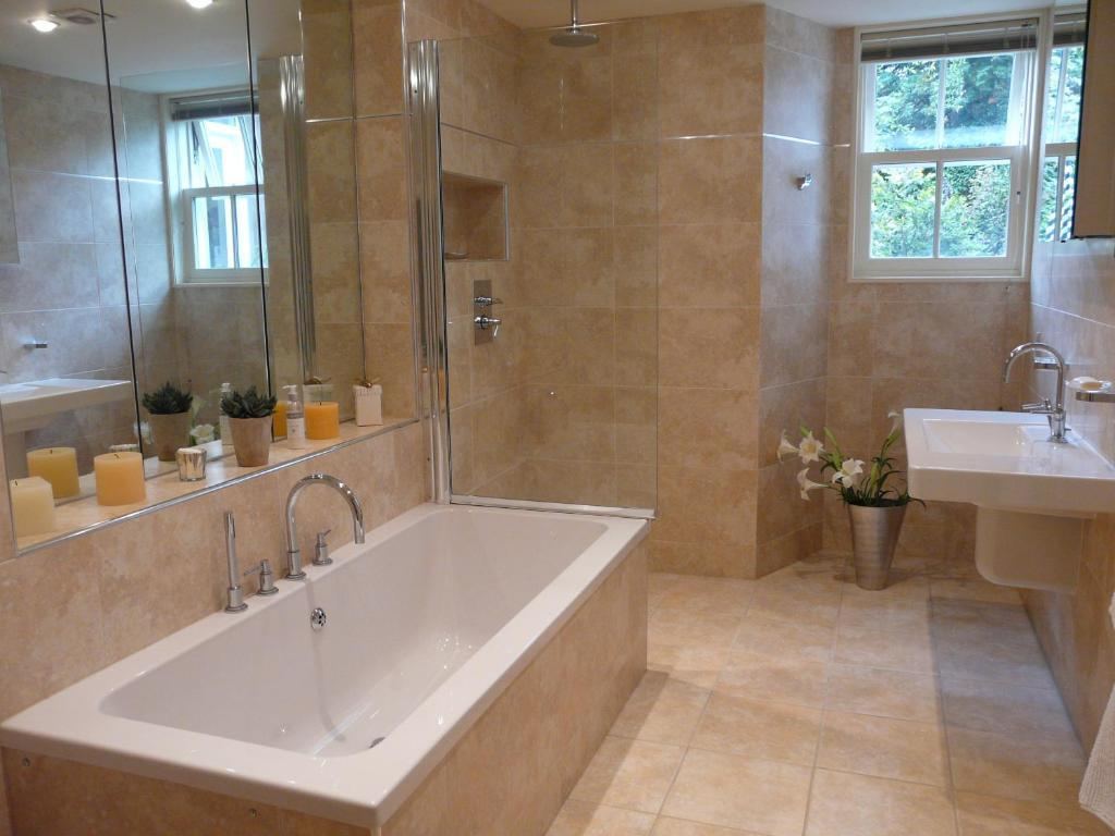 Private bathroom with bath and shower